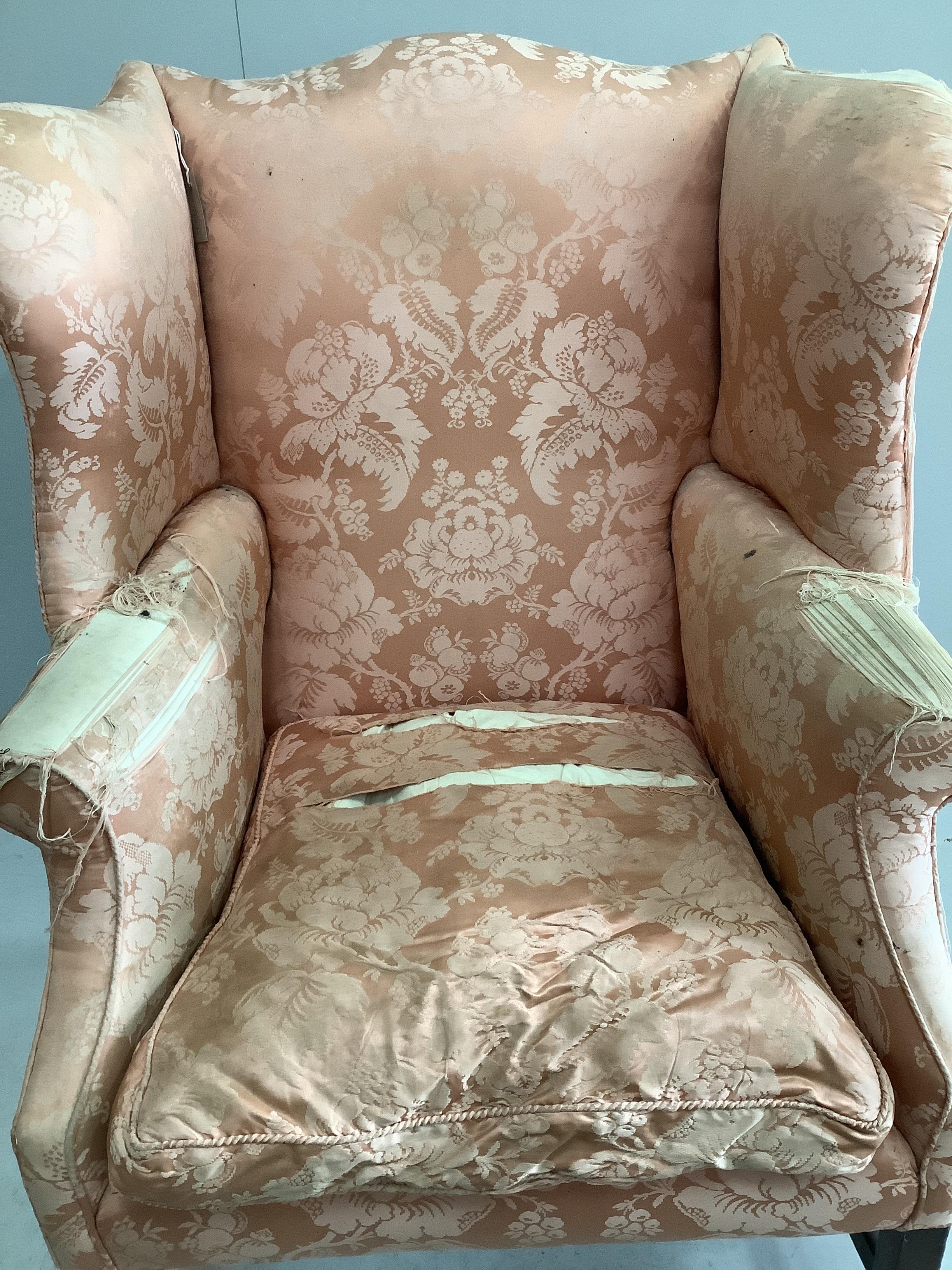 A 19th century upholstered wing armchair, width 82cm, depth 72cm, height 112cm